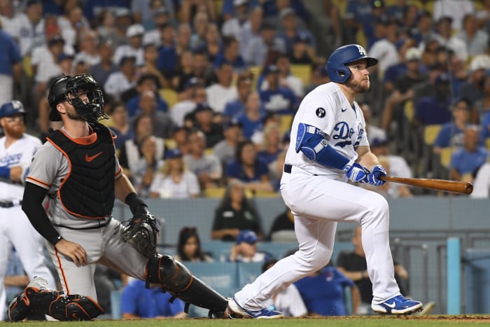 SF Giants catcher Joey Bart and Dodgers slugger Max Muncy watch a home run. (2022)